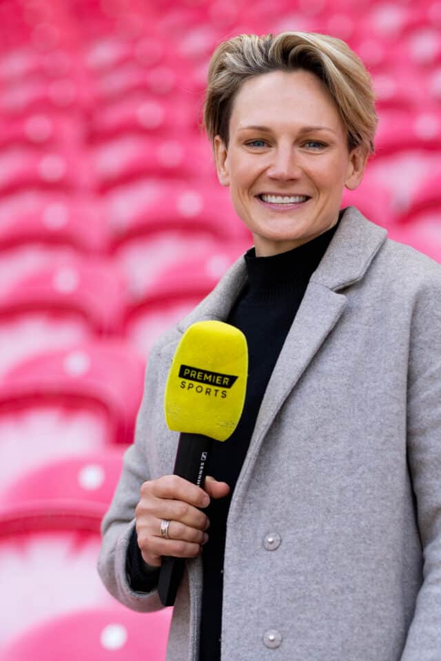 Philippa Tuttiett holding microphone